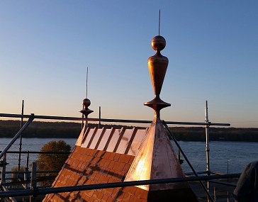 Brass finials on the Depot's peak